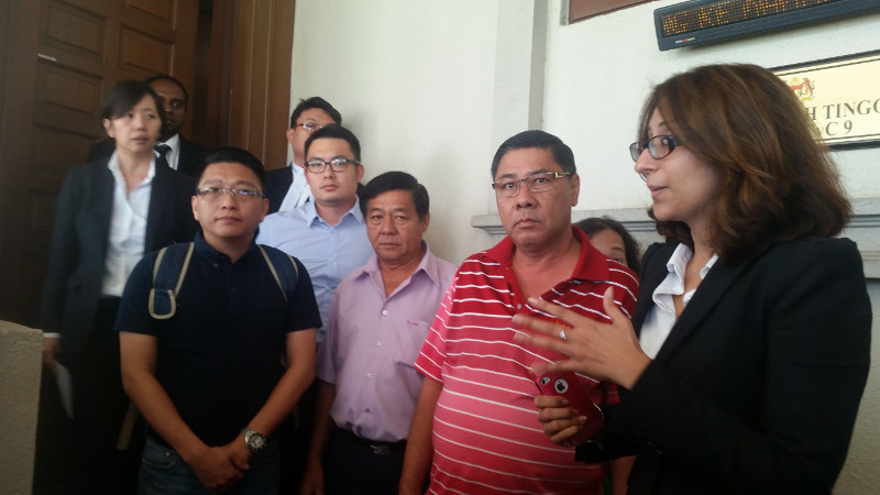 Lawyer Sangeet Deo (right) speaks to members of the media, accompanied by relatives of passengers Tan Ah Meng, his wife Chuang Hsiu Ling, and son Tan Wei Chew, who were aboard the missing MAS flight MH370 on March 4, 2016. u00e2u20acu201d Picture by Ida Lim