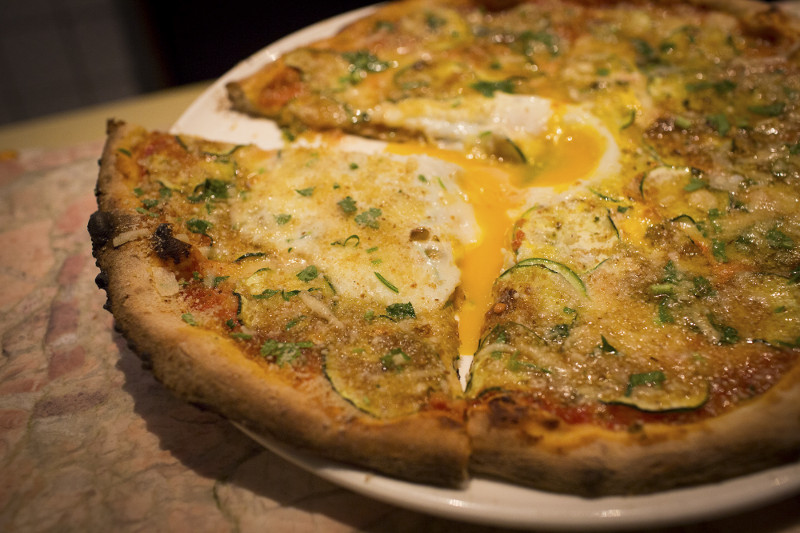‘Raggio di Sole,’ a zucchini, egg and basil pizza served at Mezzaluna, the iconic trattoria which opened in 1984 in New York, March 1, 2016.