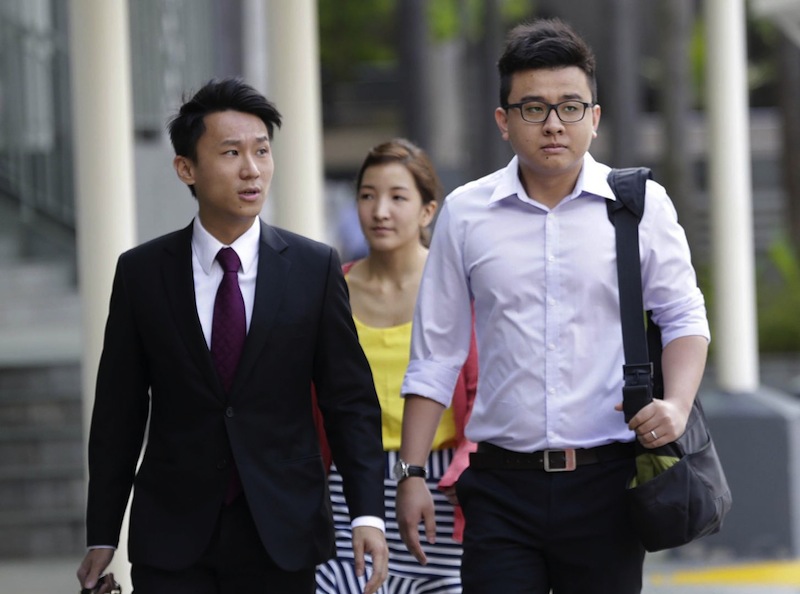 Yang Kaiheng (right) and his wife Ai Takagi at the State Court on March 28, 2016. u00e2u20acu201du00c2u00a0TODAY pic
