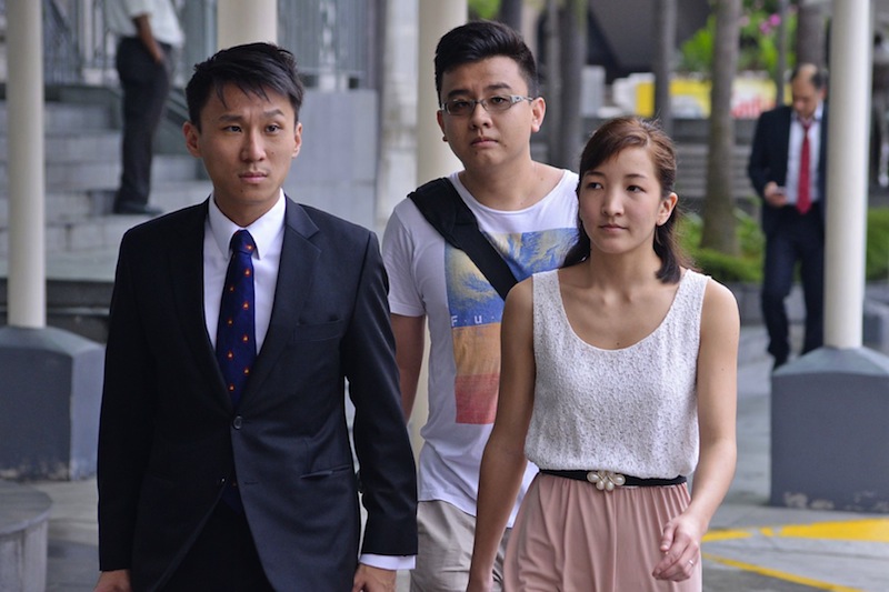 Yang Kaiheng (centre), one of the former editors of The Real Singapore (TRS), and Ai Takagi (right) walking into the State Courts, with the lawyer on March 8, 2016. u00e2u20acu201d TODAY pic