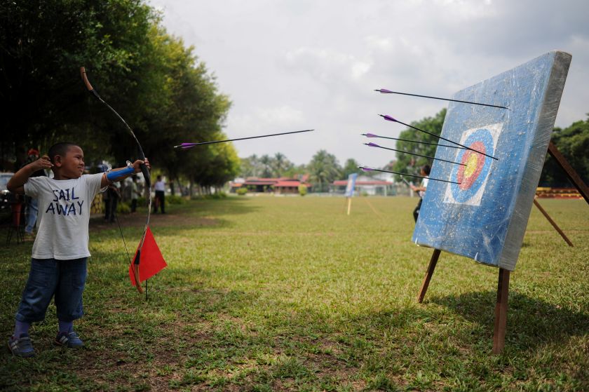 A Malaysian boy unleashes his arrow to a target at very close range at an archery session during the school holidays in Hulu Langat, near Kuala Lumpur on March 19, 2016. u00e2u20acu201d AFP pic