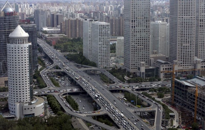 Vehicles drive on the Guomao Bridge through Beijing's central business district, June 11, 2015. u00e2u20acu201d Reuters pic