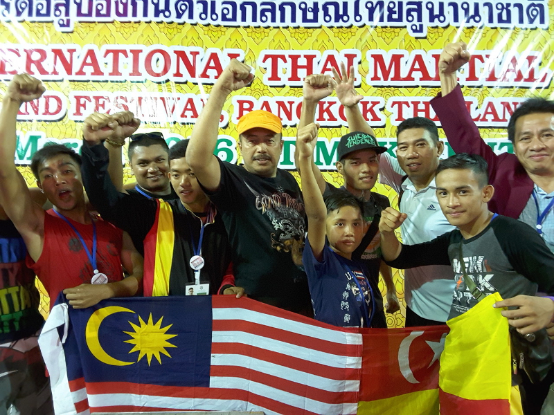 National Muay Thai athletes pose for a picture after winning four gold and two silver medals in the 1st International Thai Martial Arts Games in Bangkok March 16, 2016. u00e2u20acu201d Bernama pic