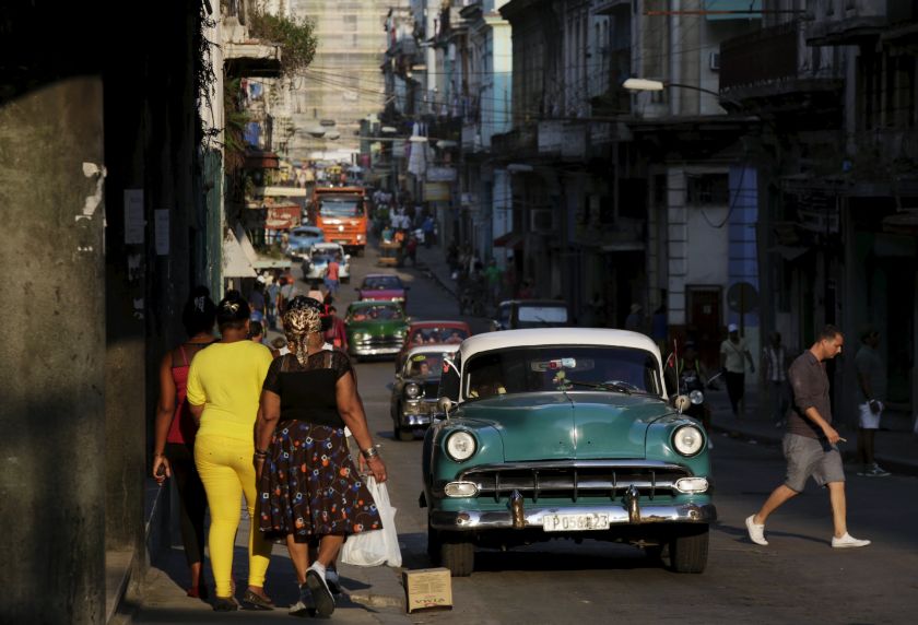 A 1954 Chevrolet car used as a taxi drives as people walk on a street in Havana March 17, 2016. u00e2u20acu201d Reuters pic