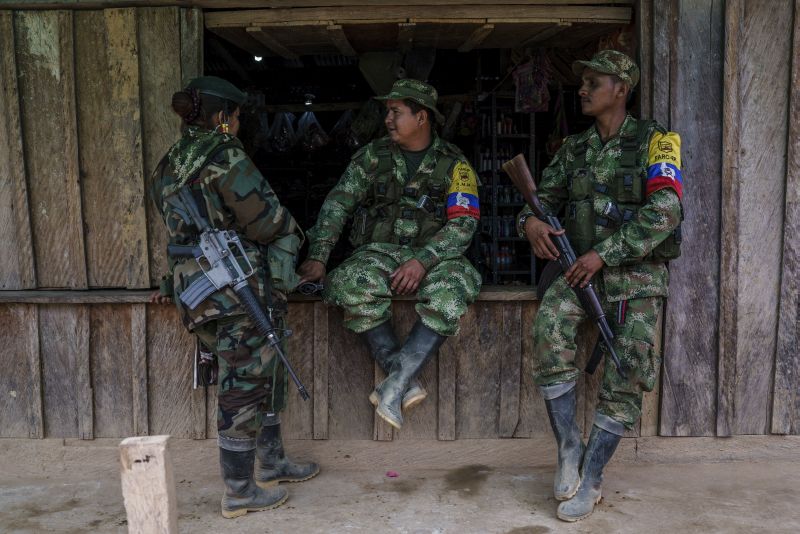 FARC rebels rest on a window of a local store at a small village in the mountains of Colombia in March, 2016. u00e2u20acu201d The New York Times pic