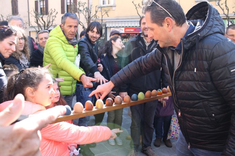 Brightly coloured Easter eggs are distributed to townspeople in Italy. ― Picture by Francine Segan/Zester Daily