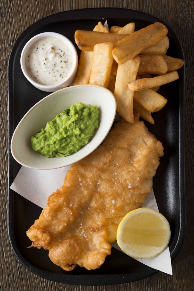Traditional fish and chips, crushed peas, tartar sauce, from Bread Street Kitchen. — TODAY pic