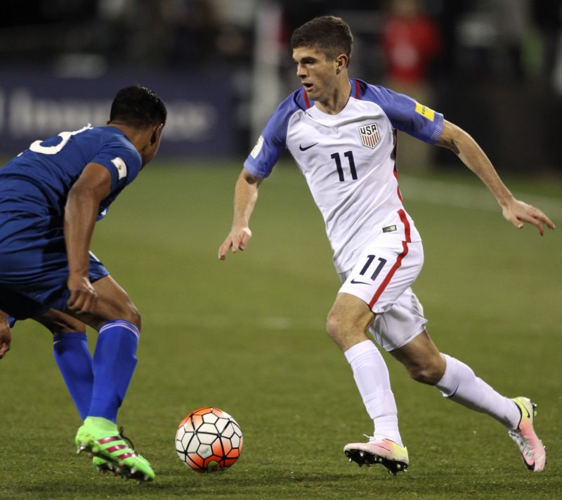 USA midfielder Christian Pulisic (R) v Guatemala defender Carlos Castrillo, 2018 Fifa World Cup qualifying semifinal round match, Columbus, Ohio, March 29, 2016. USA won 4-0. Paul Vernon / AFP