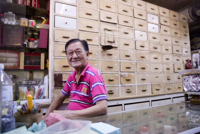 Ngew Koo Tian who runs a medical hall is worried whether his furniture can fit into his new premises.