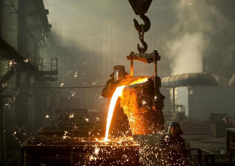 A worker fills molds with molten iron at an iron foundry in Bobruisk, southeast of Minsk. u00e2u20acu2022 Reuters pic