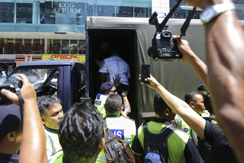 A taxi driver is arrested by police during a protest against SPAD and Uber near Pavilion Kuala Lumpur March 29, 2016.