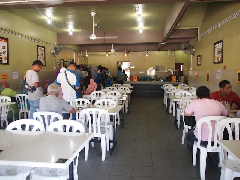Follow the order here and patiently wait in the queue for your food.