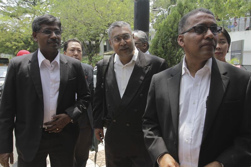 Charles Hector (centre), R. Shanmugam (left) and Francis Pereira arrive at Bukit Aman to give their statements in Kuala Lumpur, March 31, 2016. u00e2u20acu2022 Picture by Yusof Mat Isa