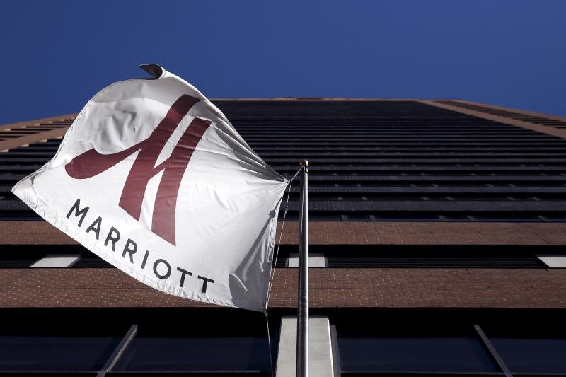 A Marriott flag hangs at the entrance of the New York Marriott Downtown hotel in Manhattan, New York November 16, 2015. u00e2u20acu201d Reuters pic