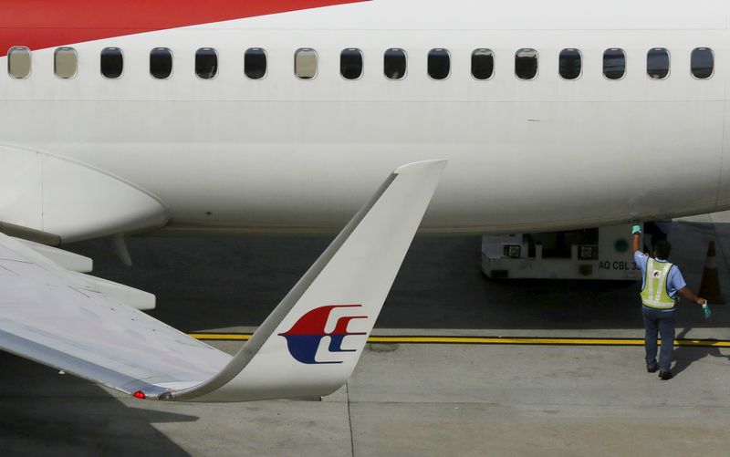 A member of ground staff works on a Malaysia Airlines aircraft at Kuala Lumpur International Airport in Sepang,  March 2, 2016. u00e2u20acu201d Reuters pic