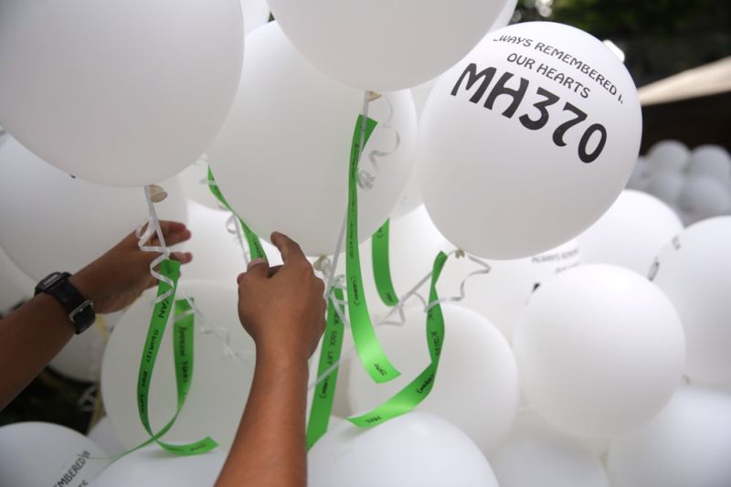 Balloons with the names of the victims of flight MH370 are tied together during the MH370 anniversary in Publika, March 16, 2016. u00e2u20acu201d Picture by Choo Choy May