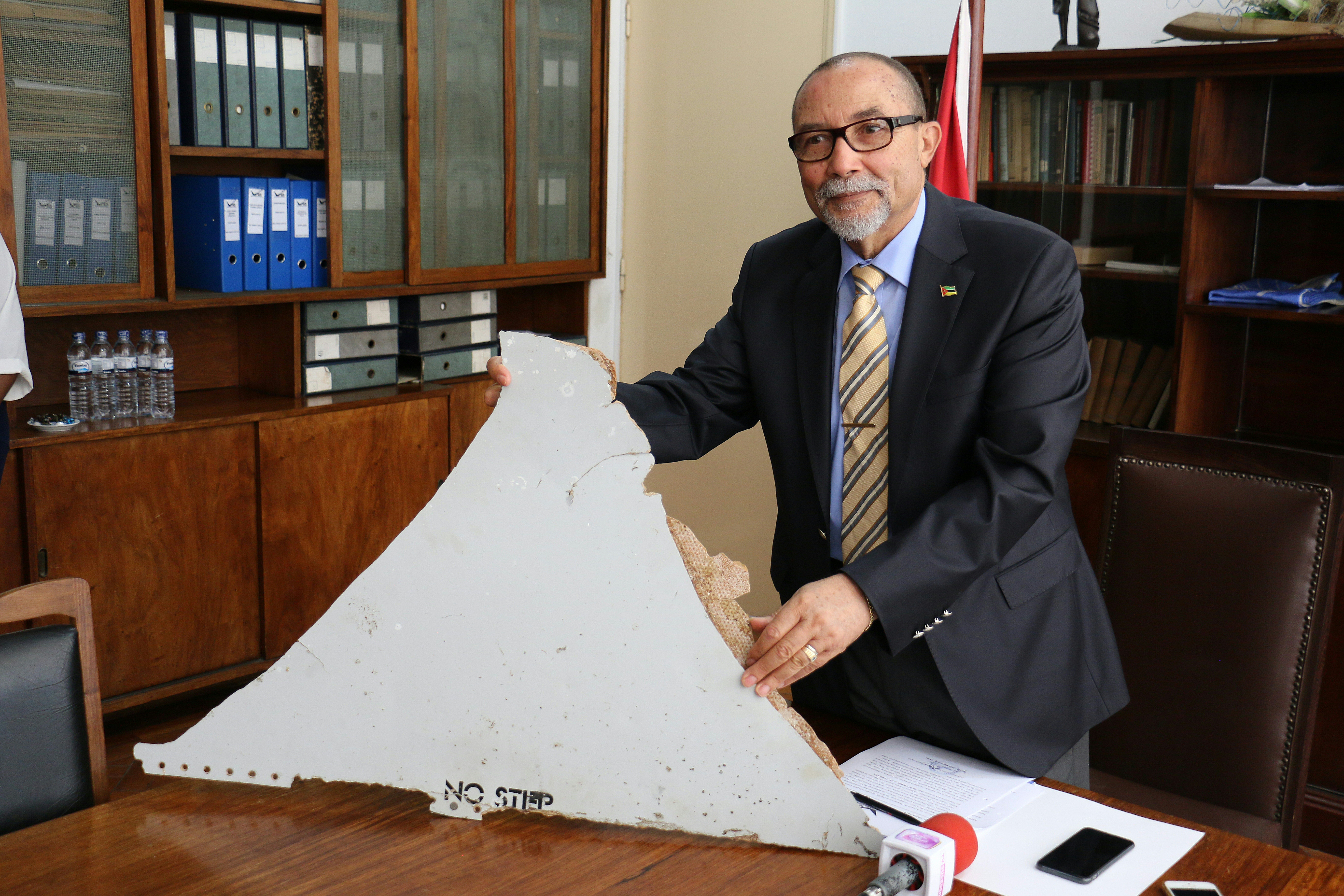 File picture shows Joao de Abreu, president of Mozambique's Civil Aviation Institute, holding a piece of suspected aircraft wreckage found off the east African coast of Mozambique at Mozambiqueu00e2u20acu2122s Civil Aviation Institute in Maputo on March 3, 2016. u00e2u20acu201d 