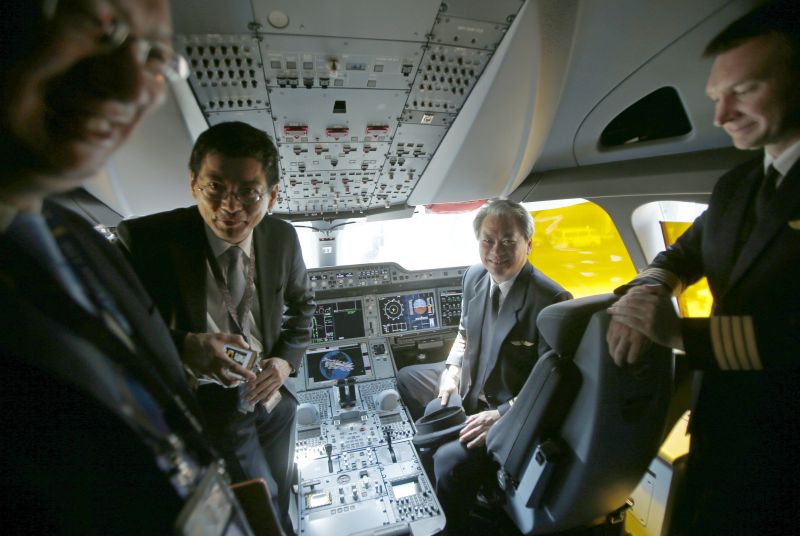 Guests tour the cockpit of the first of 67 new Airbus A350-900 planes delivered to Singapore Airlines at Singaporeu00e2u20acu2122s Changi Airport March 3, 2016. REUTERS/Edgar Su