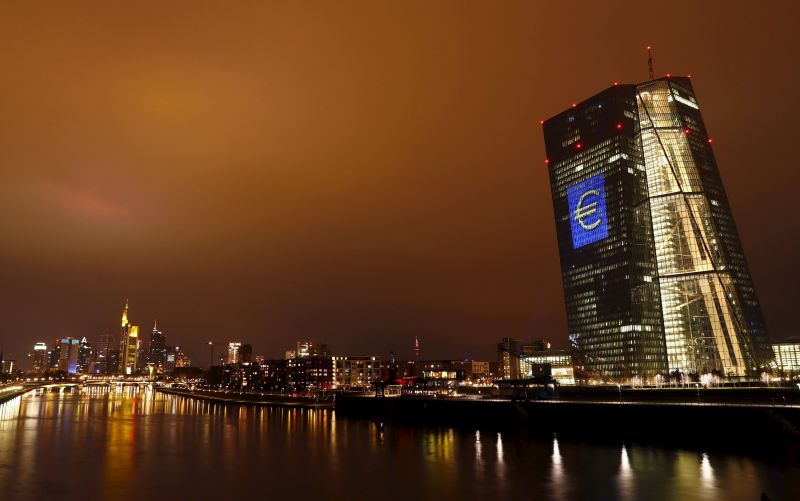 The headquarters of the European Central Bank (ECB) illuminated with a giant euro sign at the start of the u00e2u20acu02dcLuminale, light and buildingu00e2u20acu2122 event in Frankfurt March 12, 2016. REUTERS/Kai Pfaffenbac