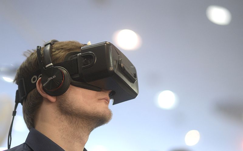 A visitor uses Oculus virtual reality goggles at the exhibition stand of locomotionVR at the worldu00e2u20acu2122s biggest computer and software fair CeBit in Hanover, Germany, March 14, 2016. u00e2u20acu201d Reuters pic