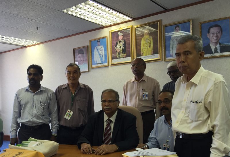 Dr P Ramasamy (centre) and the stateless people committee has helped 654 individuals to apply for birth certificates, identity cards and citizenships but only 44 were approved. u00e2u20acu201d Picture by Opalyn Mok