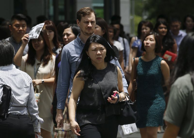 Office workers leave for lunch at the central business district in Singapore March 23, 2016. u00e2u20acu201d Reuters pic 