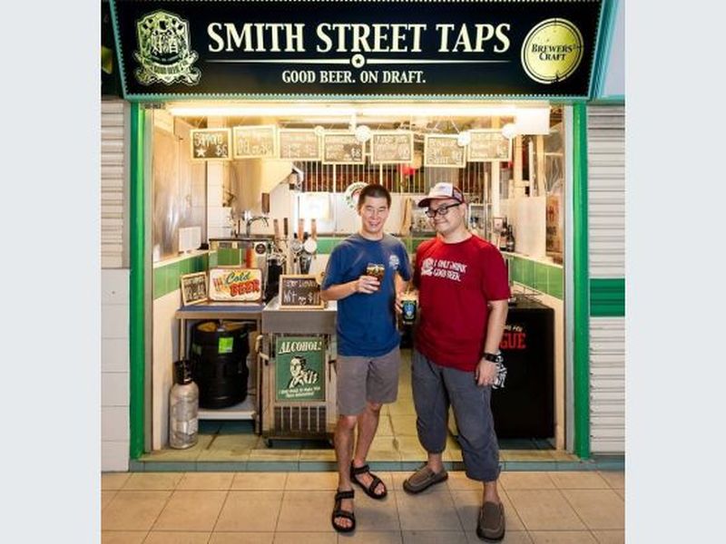 Daniel Goh (right), with his partner Meng Chao, at their shop Smith Street Taps, providing craft beers on tap in the heart of Chinatown. — TODAY pic