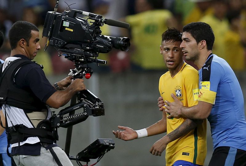 Luis Suarez (right) of Uruguay tries to control Neymar of Brazil at the World Cup qualifier in Recife, Brazil March 25, 2016. u00e2u20acu201d Reuters pic