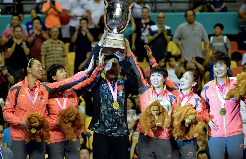 The China womenu00e2u20acu2122s team holding aloft the Perfect 2016 World Team Table Tennis Championship trophy after defeating Japan 3-0 at Stadium Malawati in Shah Alam March 6, 2018. u00e2u20acu201d Bernama pic