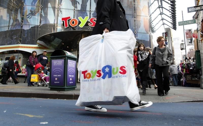 Shoppers pass by the Toys R Us store at Times Square in New York November 22, 2010. u00e2u20acu201d Reuters pic