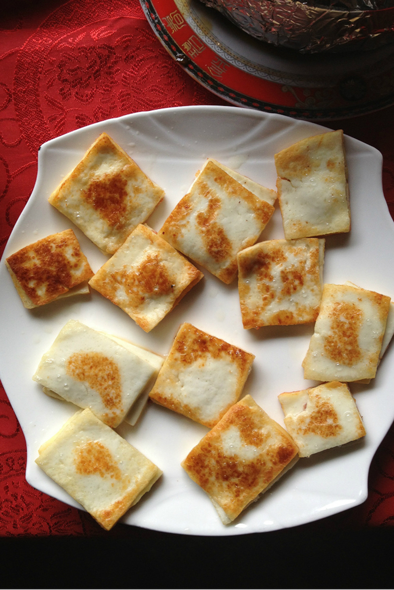 Grilled rubbing, a type of firm cheese, is grilled with thin slices of local ham, or served with bowls of salt and sugar to dip it into. — Picture by Georgia Freedman/Zester Daily via Reuters