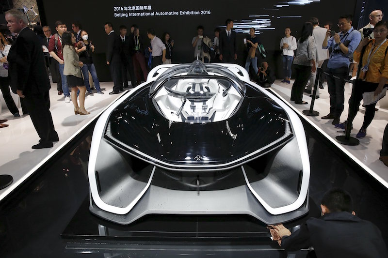 Visitors gather around the Faraday Future FFZERO1 electric concept car during the Auto China 2016 auto show in Beijing April 25, 2016. u00e2u20acu201d Reuters pic