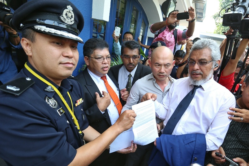 Opposition lawmakers hand over a memorandum to the police seeking PKR’s Rafizi Ramli’s release, at Bukit Aman, Kuala Lumpur April 7, 2016. — Picture by Saw Siow Feng