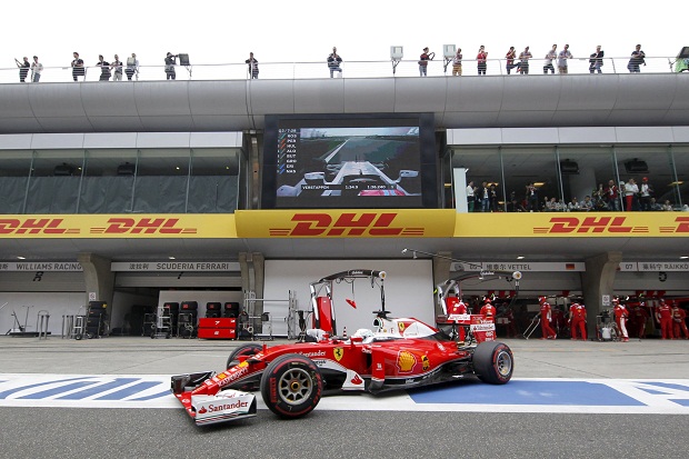 Ferrari Formula One driver Sebastian Vettel of Germany steers his car out of his team’s garage during the qualifying session in Shanghai, April 17, 2016.