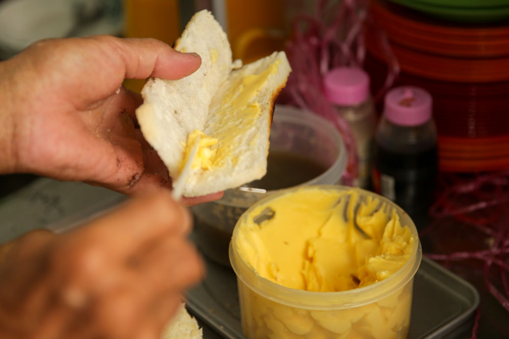 The toast is slathered with kaya and butter.