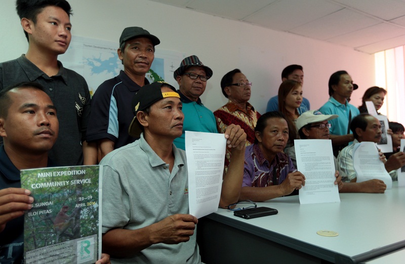 Mastupang (second from left) is one of 2,500 villagers from Pitas, objecting to the expansion of a controversial shrimp park which they claimed has had adverse effects on the villageru00e2u20acu2122s source of income and livelihood. u00e2u20acu201d Picture by Julia Chan