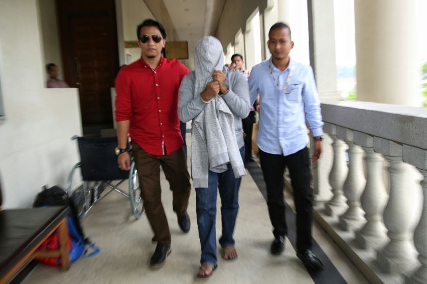 Businessman Abdul Gafar Abdurahiman was today charged with 63 counts of money laundering over the transfer of over RM15.7 million to a former Youth and Sport Ministry official implicated in a corruption scandal. u00e2u20acu201d Picture by Saw Siow Feng. 