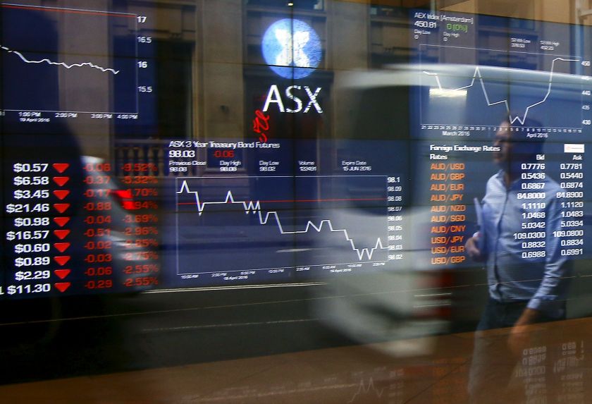 Pedestrians are reflected in a window displaying stock prices outside the Australian Securities Exchange (ASX) in Sydney, Australia April 20, 2016. u00e2u20acu201d Reuters pic