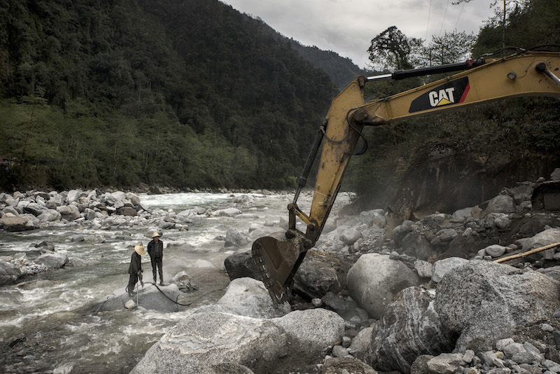 Early stages of construction work on a project aimed at increasing tourism, along the Dulong River in the Yunnan province of China, April 2, 2016. — Picture by Gilles Sabrie/The New York Times