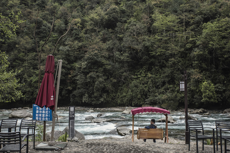 Seating connected to the Green Cottage, a boutique style tourism hotel along a subsidiary of the Dulong River, near Kongdang, China, April 3, 2016. — Picture by Gilles Sabrie/The New York Times