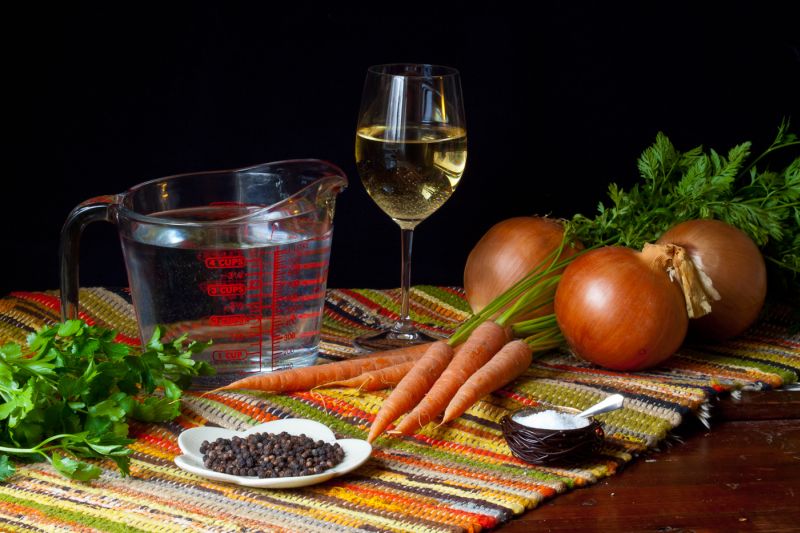 Court Bouillon is tap water with a little bit of salt, peppercorn, sliced onion, parsley, bay leaf, sliced carrot and something acidic u00e2u20acu2022 often lemon juice, but equally often white wine and occasionally vinegar. u00e2u20acu2022 Picture by Susan Lutz/Zester Daily