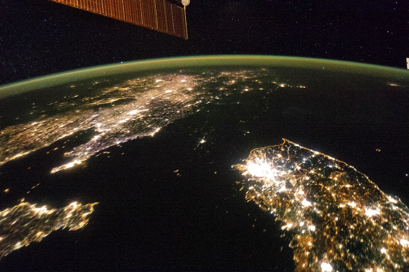 In an undated handout photo, the Korean Peninsula viewed from the International Space Station shows a mostly dark North Korea. If the North Korean economy is booming, it is a purely daytime affair. u00e2u20acu201d Picture by Nasa via The New York Times 