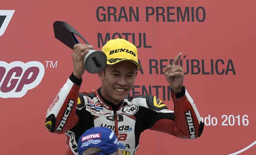 Malaysian biker Khairul Idham Pawi celebrates on the podium after winning the Moto3 race of the Argentina Grand Prix at Termas de Rio Hondo circuit, in Santiago del Estero, Argentina April 3, 2016. u00e2u20acu201d AFP pic