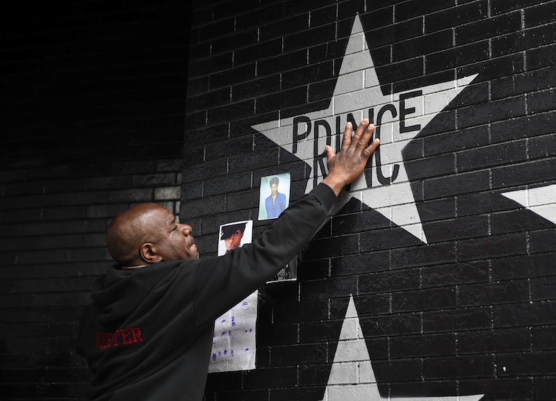 Donnie Straub touches a star bearing Prince's name on an exterior wall of First Avenue, the nightclub where Prince got his start in Minneapolis, Minnesota, April 21, 2016. u00e2u20acu201d Reuters pic