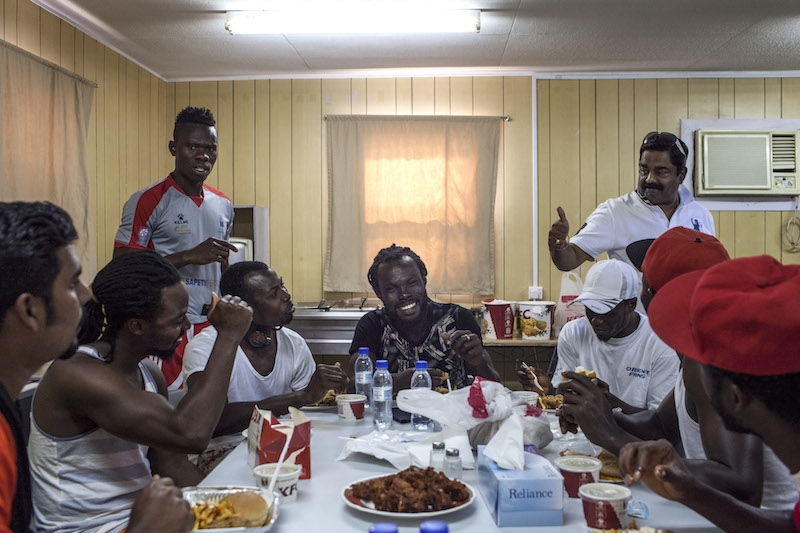 Gulf Contracting players celebrate with a meal after winning a match in the Workers Cup, an employees’ football league in Doha April 22, 2016. — Picture by Olya Morvan/The New York Times