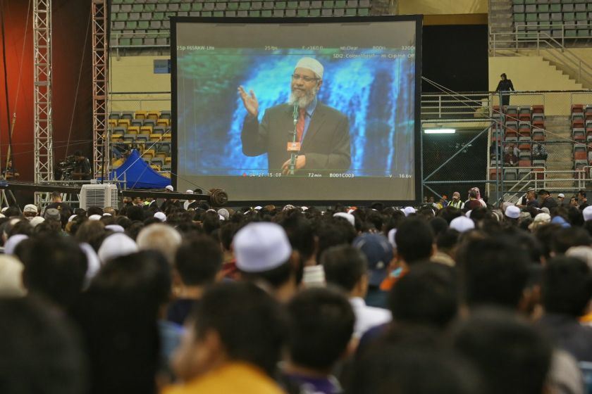 Audience brave the rain at Dr Zakir Naiku00e2u20acu2122s lecture in Bukit Jalil, Kuala Lumpur, April 16, 2016. u00e2u20acu2022 Picture by Saw Siow Feng