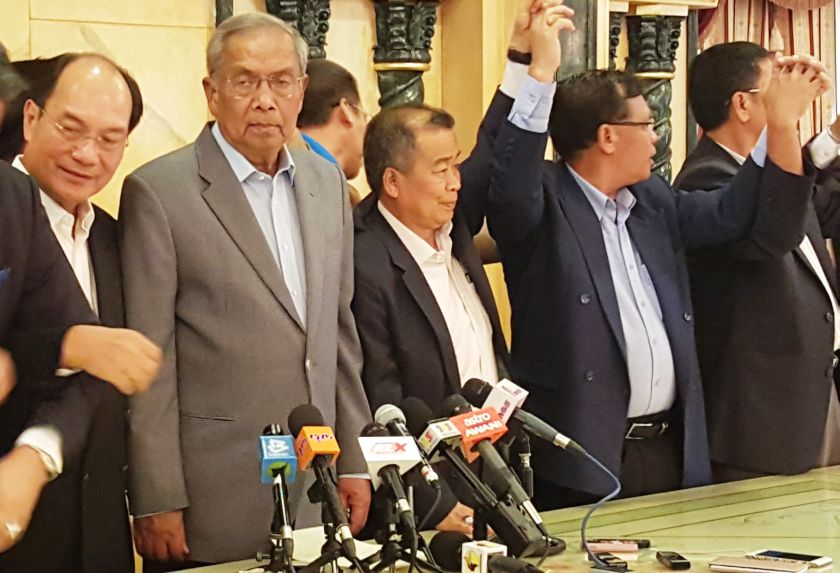 Tan Sri Adenan Satem (second left) with some of the candidates after the press conference at his office April 12, 2016. u00e2u20acu201d Picture by Sulok Tawie 
