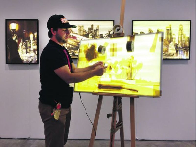 Dutch artist Max Zorn demonstrates his tape art method of making work. u00e2u20acu2022 Picture by Mayo Martin/TODAY