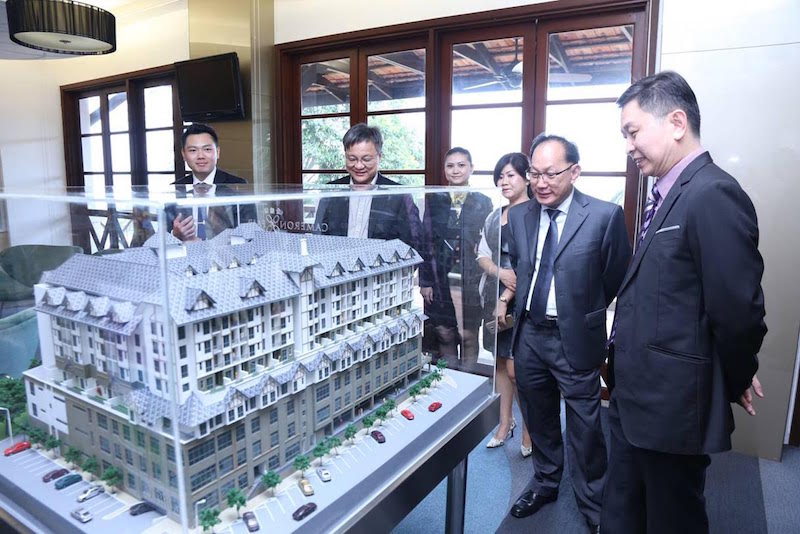 Guests look at the development model unit of Avillion Cameron Highlands Township, in the Riau Hospitality Lounge of Avillion Port Dickson after the projectu00e2u20acu2122s official launch. u00e2u20acu201d Picture courtesy of Avillion Hotel Groupn
