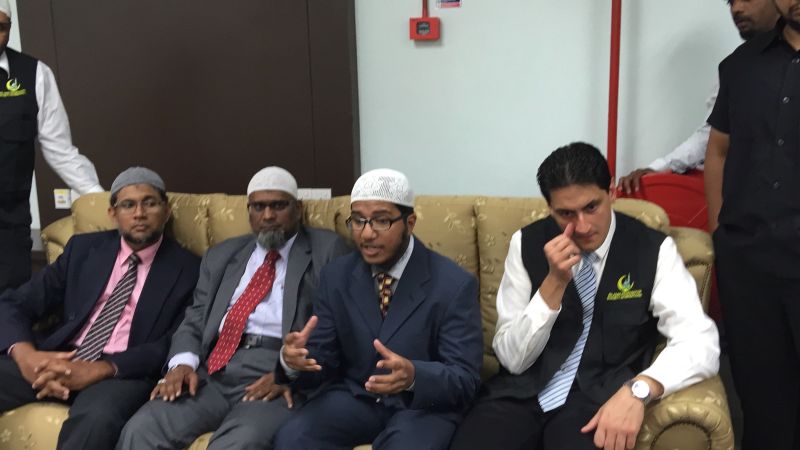 Fariq Naik (second right) speaks to the media in Penang. u00e2u20acu2022 Picture by Opalyn Mok